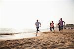 Friends Running at the Beach