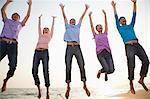 Group of Friends Jumping at the Beach