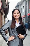 Portrait of young business woman in houhai, Beijing, China
