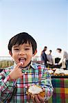 Boy eating cupcake