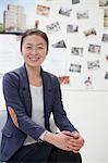 Businesswoman sitting in the office, portrait