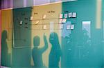 Three Businesswomen Reflected on the Wall Board