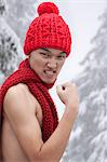 Shirtless Man with Hat and Scarf in the Snow