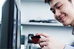 Businessman holding card in office