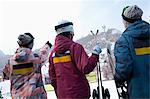 Group of People Pointing at Hill in Ski Resort