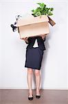 Young Businesswoman holding box of office items