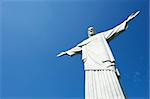 Corcovado Christ the Redeemer stands in blue sky in Rio de Janeiro Brazil