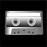 Retro music cassette isolated on black