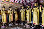 Standing Buddha statues in Dambulla Cave Temple, Sri Lanka