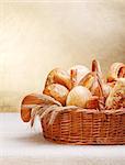 Assortment of bakery products on basket. Copy space above