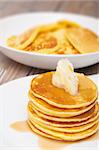 Homemade Pancakes With Butter and Warm Maple Syrup - Shallow Depth of Field
