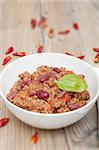 Chilli Con Carne in White Bowl and Red Chili Peppers - Shallow Depth of Field