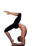 caucasian man Eka Pada Viparita Dandasana One-legged Inverted Staff  pose stretch acrobatics yoga balance posture isolated studio on white background