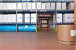 Distribution warehouse with paper rolls and printing material