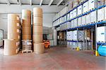 Distribution warehouse with paper rolls and material for printing