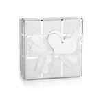 Silver gift box with bow and heart label. Isolated on white background