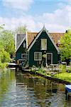 rural dutch scenery of small old houses and canal in Zaanse,  Netherlands
