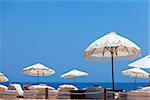 Umbrellas on the beach in the sunny day