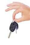 hand holding a car keys isolated on white background