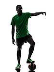 one african man soccer player green jersey free kick in silhouette  on white background