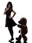 one caucasian strange young woman and vicious teddy bear  in silhouette white background