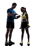 one  woman exercising fitness workout with man coach using digital tablet  in silhouette  on white background