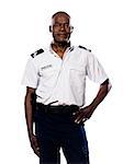 Portrait of a smart afro American policeman smiling with hand on waist in studio on white isolated background