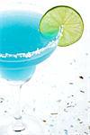 Blue margarita cocktail with lime slice