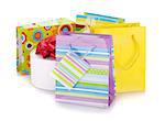 Colored gift bags and box. Isolated on white background