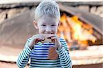 happy positive kid eating smores