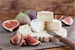 Camembert and fresh figs on a cutting board