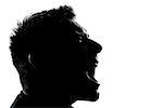 one caucasian man portrait silhouette profile screaming angry in studio isolated white background
