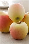 Ripe apples and pears on the rough linen tablecloth