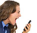 Angry business woman shouting in mobile phone
