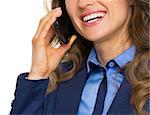 Closeup on happy business woman talking mobile phone