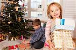 Small girl holding gift boxes, Munich, Bavaria, Germany