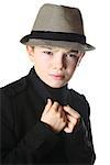 Young boy wearing a hat on white background