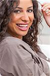 Studio portrait of a beautiful young mixed race Latina Hispanic woman smiling