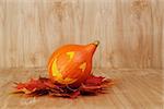 halloween funny striped pumpkin, on wood table