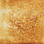 texture of toasted hot white bread, crispy orange background