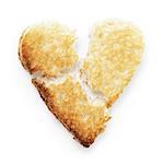 toasted slice of white bread heart shape, on white background with shadow