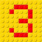 Red number three in yellow plastic construction kit. Typeface  sample.