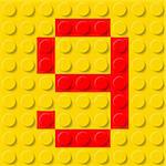 Red number nine in yellow plastic construction kit. Typeface  sample.