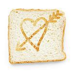 slice of bread with heart and arrow, on white background with shadow