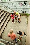 Overhead view of group of children standing on outdoor stairway, Germany
