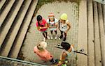 Overhead view of group of children standing on outdoor stairway, Germany