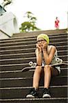 Girl Sitting on Steps with Skateboard, Mannheim, Baden-Wurttemberg, Germany