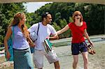 Three friends near Isar River, Munich, Germany