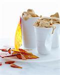 Still life with cups of salted caramel ice cream and toffee shards