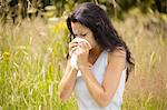 Girl wiping nose with tissue